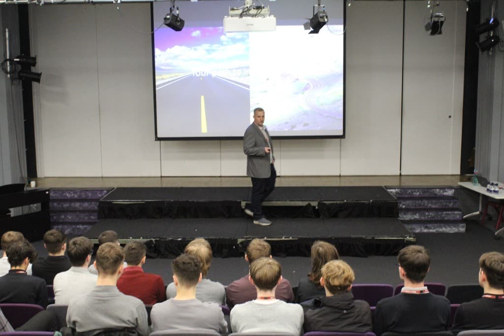 Dan Warrener speaking to an audience about technology